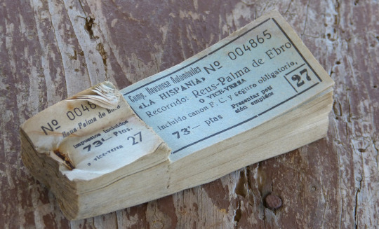 A book of old-fashioned tickets.